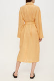 Female linen robe in ochre