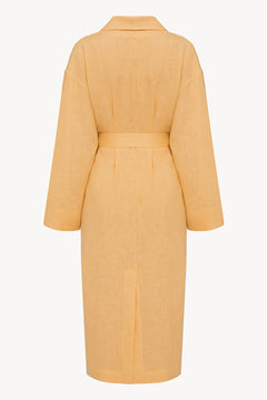 Female linen robe in ochre